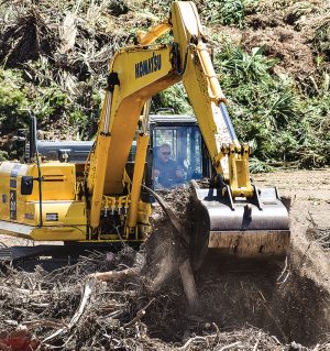 John Desrosiers (in excavator cab) started 1 Stop after recognizing a need for a reliable organics recycling operation in the greater Tampa/Sarasota market in Florida.