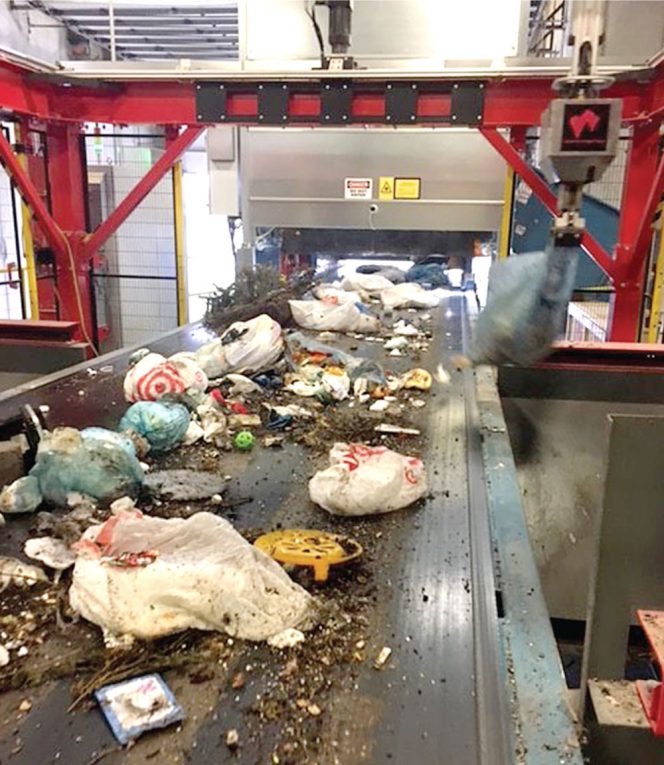 Organix Solutions installed an automated bag sorting system that utilizes color recognition and a robot to recover household organics contained in blue bags. 