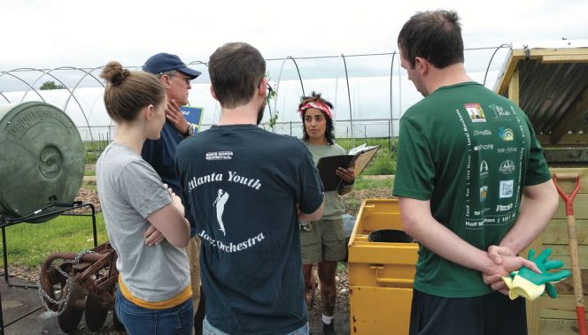 Sophia Hosain, a graduate of the NSR program and FoodCorps service member at Real Food Farm, trains community members on how to participate in the farm’s new Compost Co-op.
