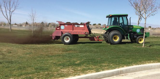 Landscape application of compost in a city park in southern California.