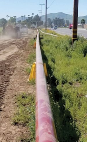 Biogas is conditioned at the CR&R anaerobic digestion facility in Perris (CA) and then transported about 1.4 miles via a high-pressure steel pipe (shown here) to the SoCalGas interconnection “point of receipt” (see next photo).