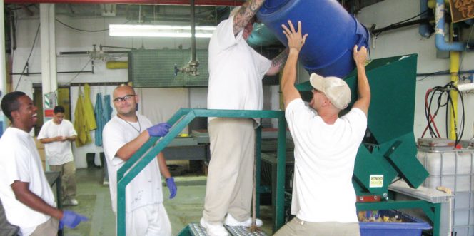 Food scraps are unloaded into a shredder at the Monroe Correctional Complex.