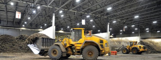 After being weighed, collection trucks from Surrey and other feedstock providers unload into one of seven receiving bays in the main building. Front-end loaders then put the material into a shredder.