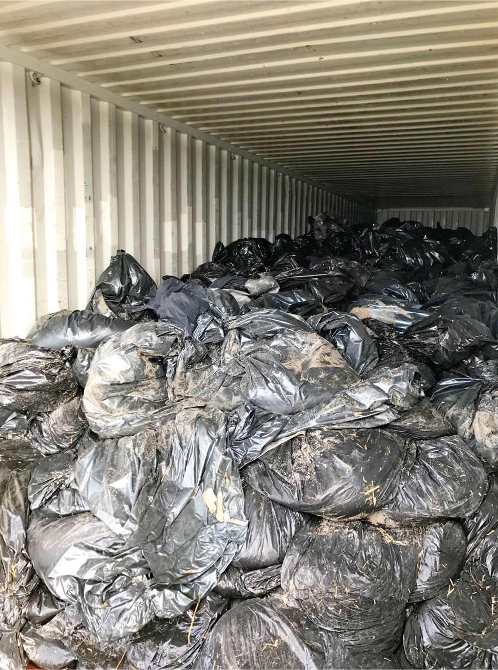 Filled bags were put in 55-gallon black contractor bags and stored in 40-foot shipping containers.