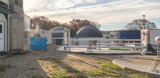 Vanguard’s newest digester is at Crescent Farm in Haverhill, Massachusetts. The two tanks with black tops are the digesters. At left is the building housing a 1 MW engine. Power will be sold to a local municipality.