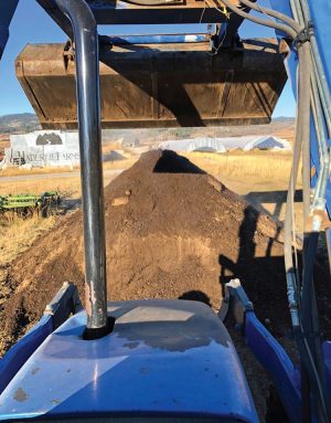 WyoFarm combines food waste with purchased wood chips, which is then composted in windrows and turned with a tractor. Finished compost (above) is used on the farm and sold to homeowners and landscapers.