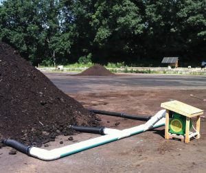 Food waste and yard trimmings can be composted using any method (aerated static pile shown at right). Food waste is high in moisture and nitrogenous, so it is critical to get the initial recipe correct.