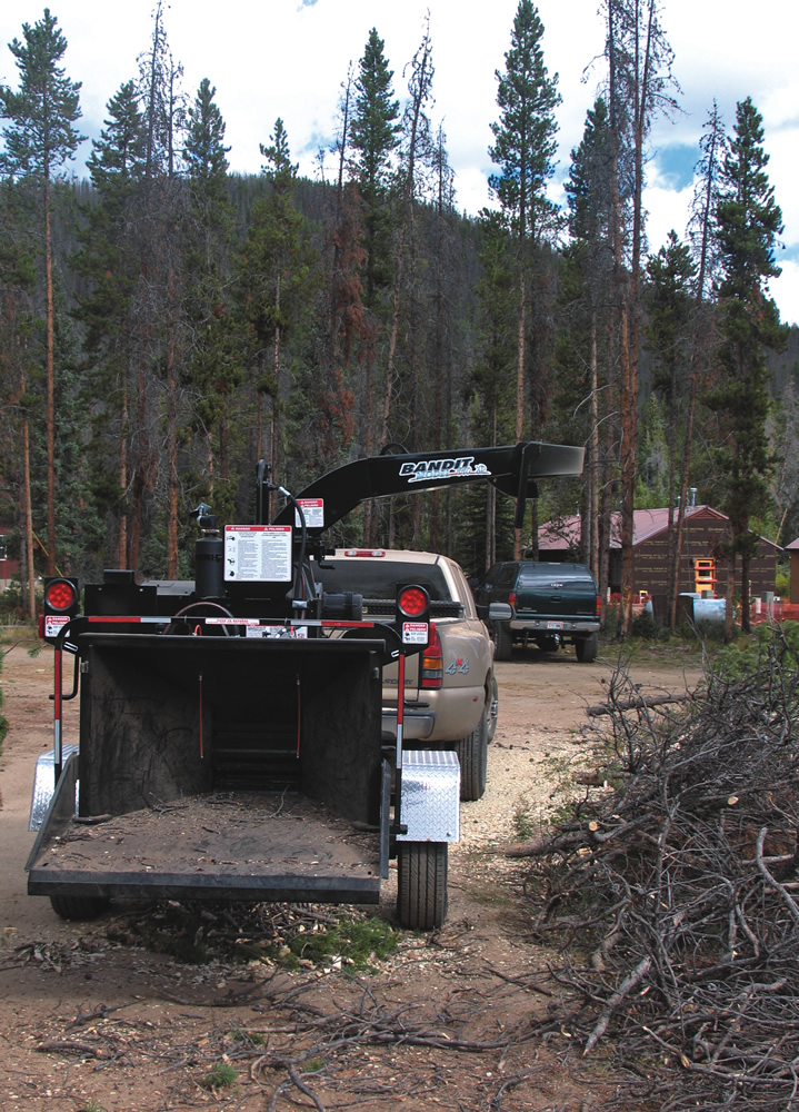 Researchers at the Fraser Experimental Forest in north central Colorado use a Bandit Model 990XP chipper to process beetle killed wood for a number of exploratory uses.