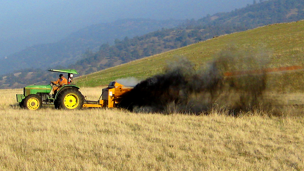 Spreading compost